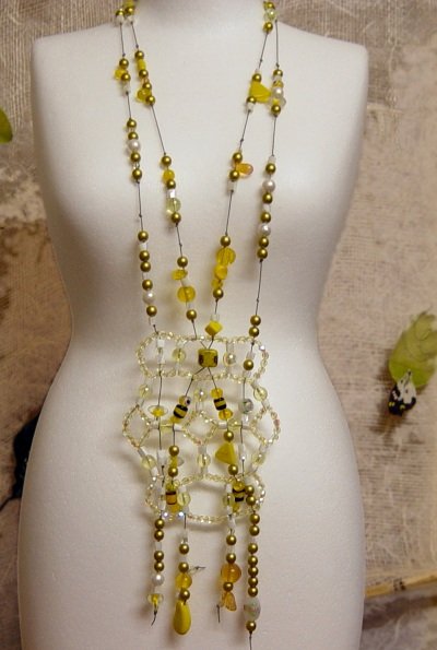 Sunflower collana perline gialle nere verdi bianche ornamento centrale intreccio di cordini spago