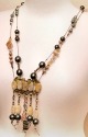 collana di perle ovali marmorizzate e filo cerato sottile