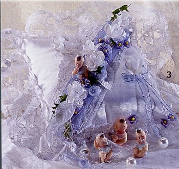bimbi nascita Battesimo cuscini da cerimonia addobbi oggettistica statuine perle bianche nastri e fiorellini azzurri